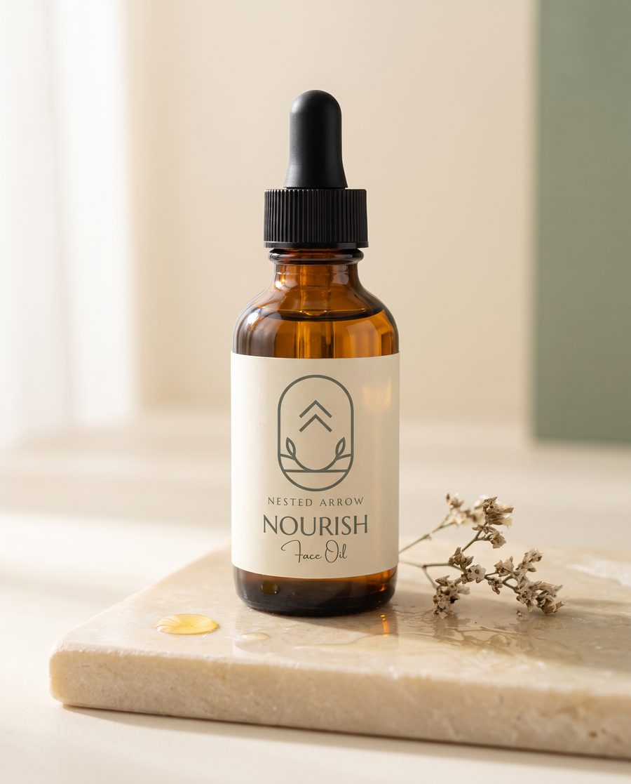 Nourish face oil, amber dropper bottle on ivory stone